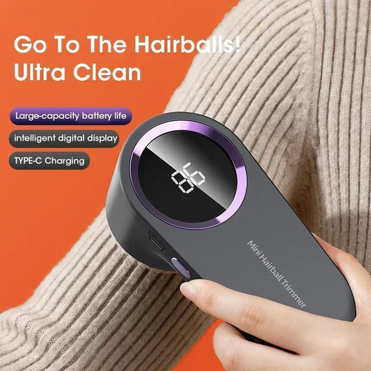 Hand holding a mini hairball trimmer with features highlighted on an orange background