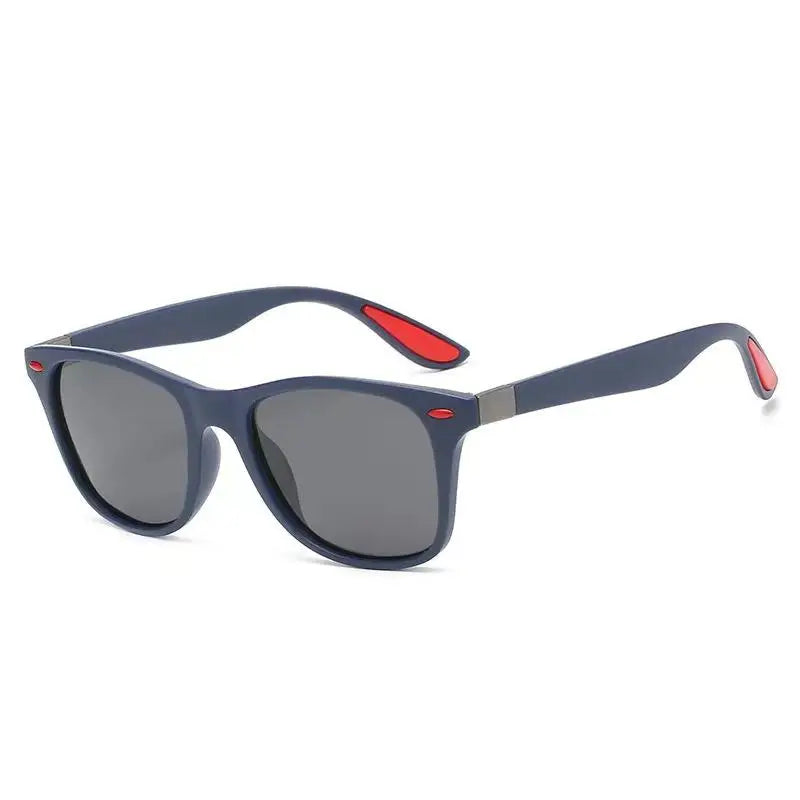 Sunglasses with blue frame and red accents on a white background