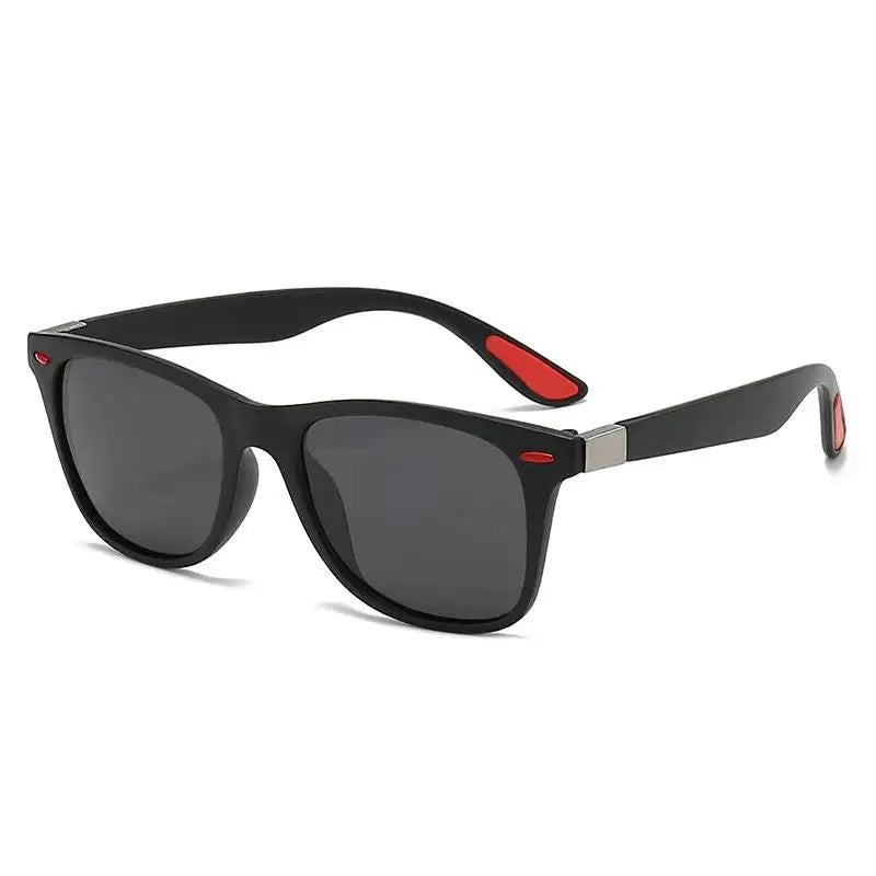 Black sunglasses with red accents on a white background