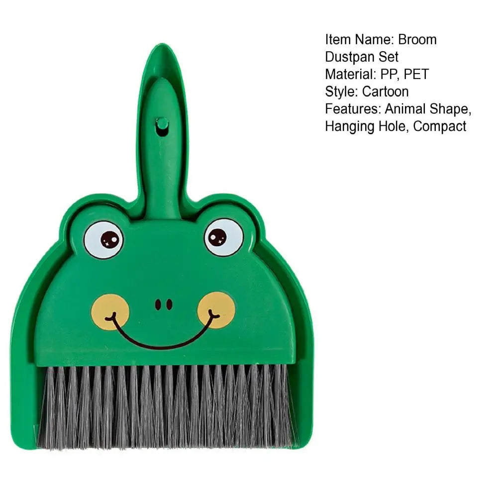 Green frog-shaped broom and dustpan set on a white background