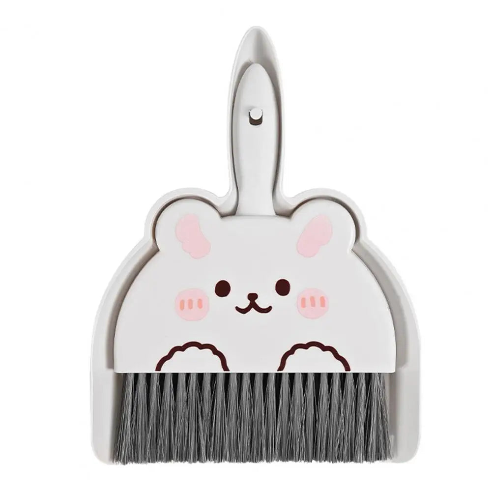 Cute white bunny-shaped broom and dustpan set on a white background