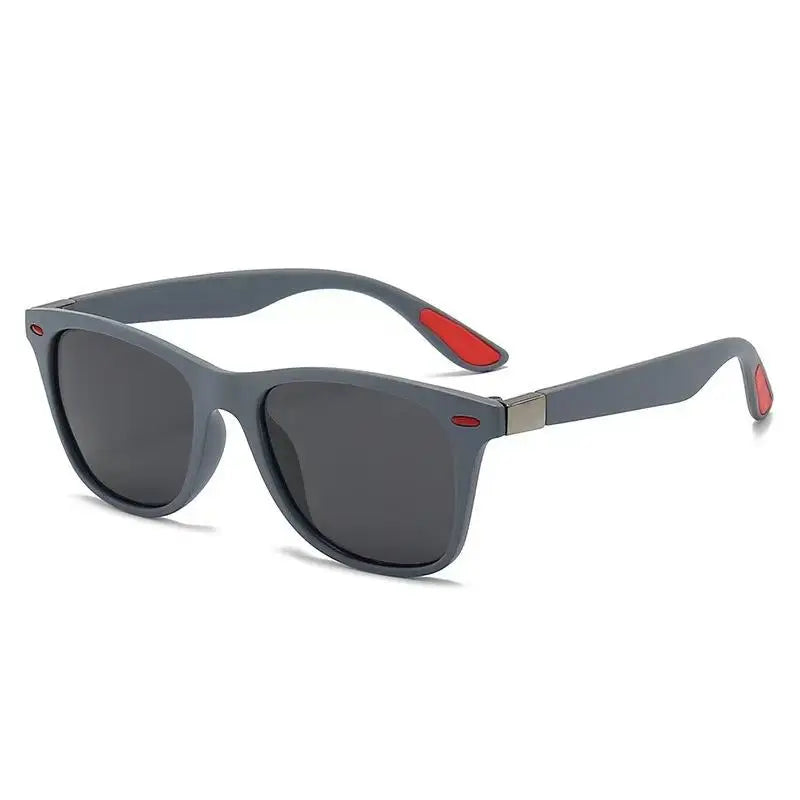 Sunglasses with gray frame and red accents on a white background