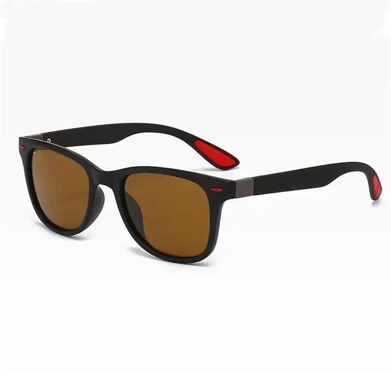 Black sunglasses with red accents on a white background