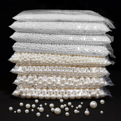 Stack of pearl packages with loose pearls on a black background