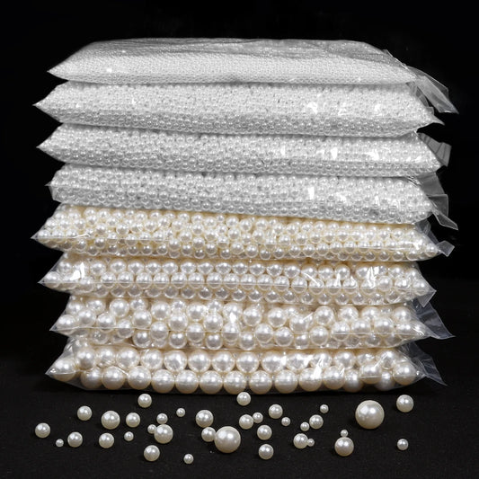 Stack of pearl packages with loose pearls on a black background