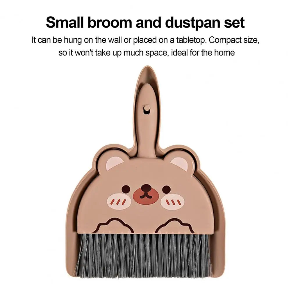 Small broom and dustpan set with bear design on a white background