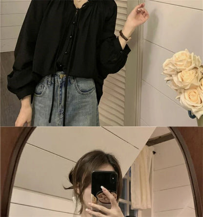 Blusa con colletto a volant e maniche a lanterna