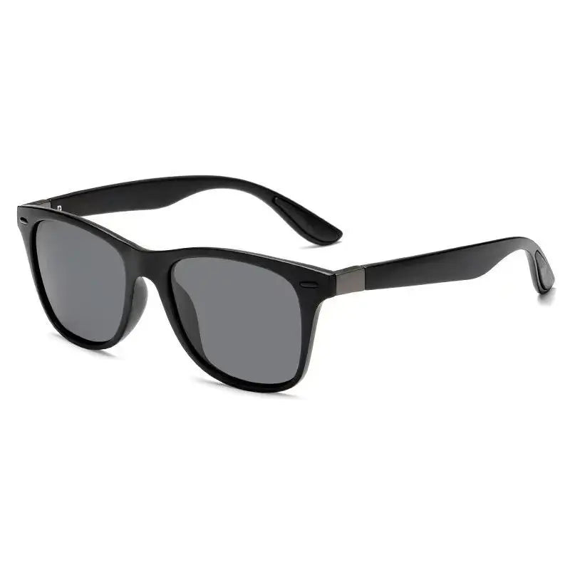 Black sunglasses with dark lenses on a white background