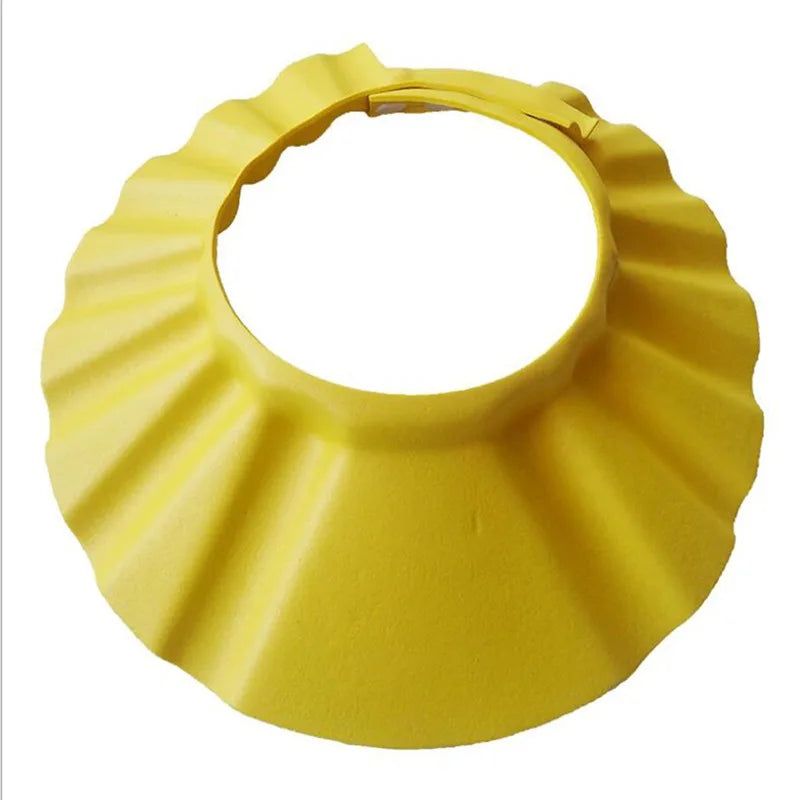 Yellow adjustable silicone shower cap on a white background