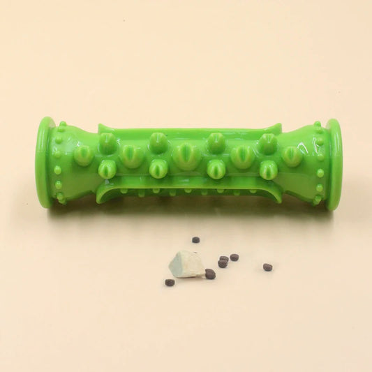 Green textured roller with small parts on a beige background