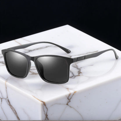Black sunglasses on a marble surface