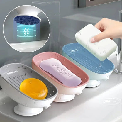 Multiple soap holders with different colored soaps on a kitchen counter.