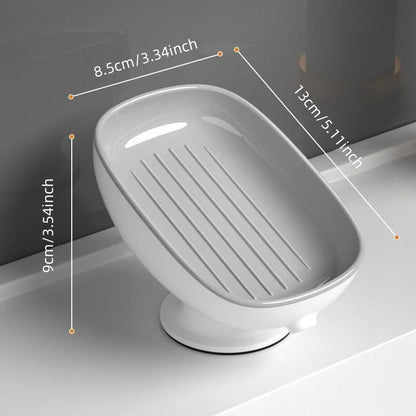 Gray soap dish with dimensions on a bathroom counter